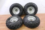 2002 Polaris Scrambler 90 Front And Rear Wheel Rim Tire Assy 7.5X7 4/110 Pcs. Fixed Price $119.00.