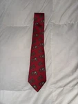 Authentic Herm 7334 Ea Silk Tie - Red Whimsical Penguins On Rocks Motif. Fixed Price $85.00.